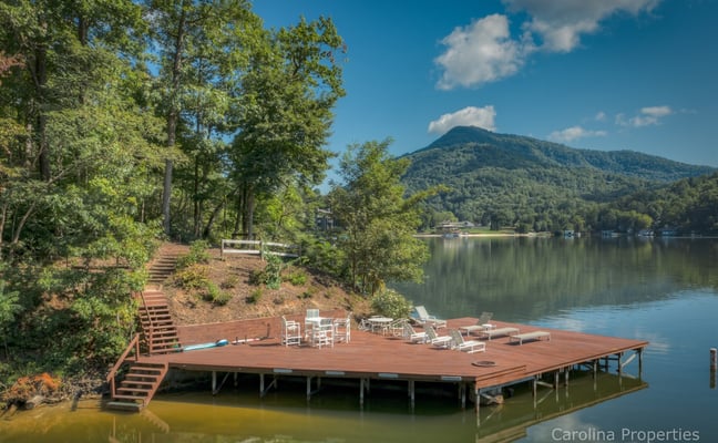 Lakeside dock with Adirondack chairs and mountain views at Lake Lure